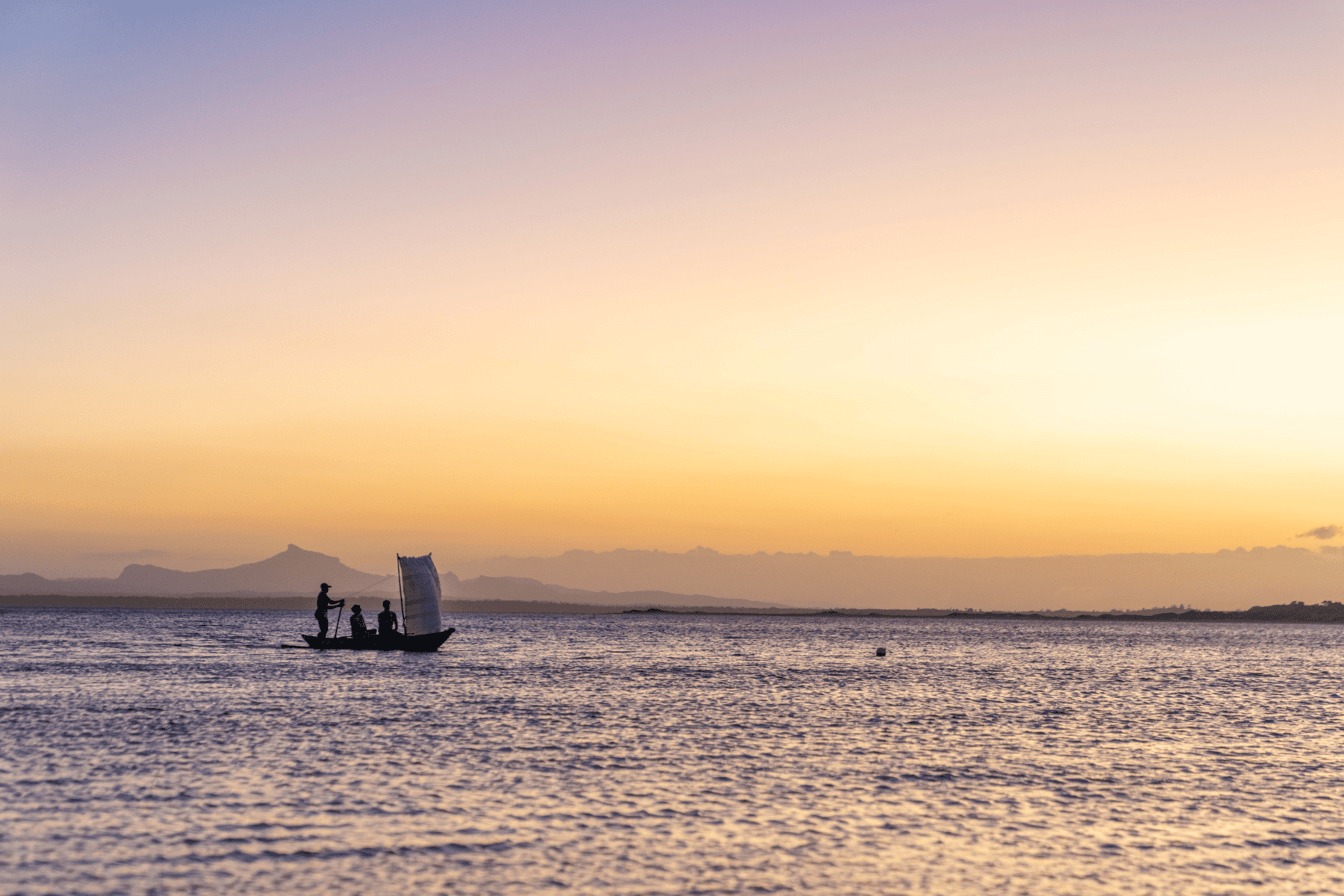 A boat at sunset at Miavana by Time + Tide