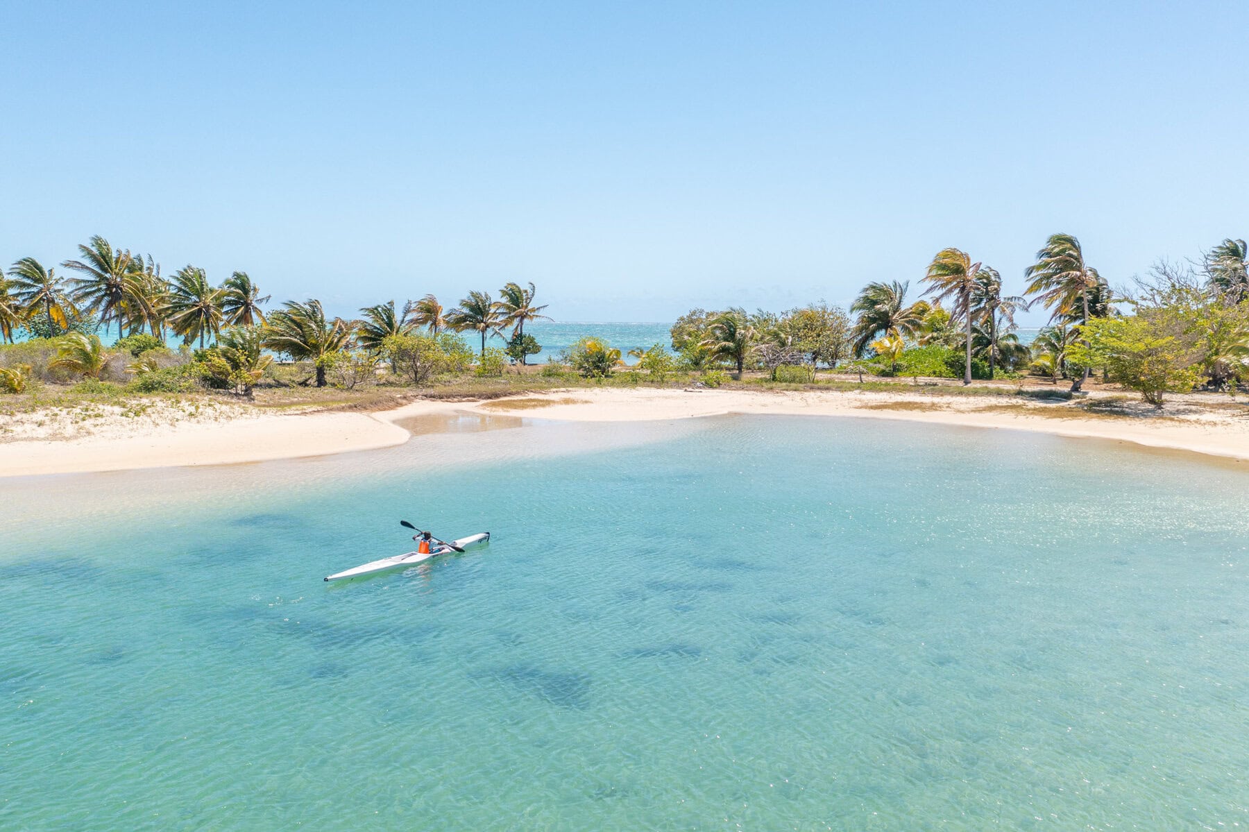 A guest out in a kayak in the ocean  Miavana by Time + Tide, Madagascar