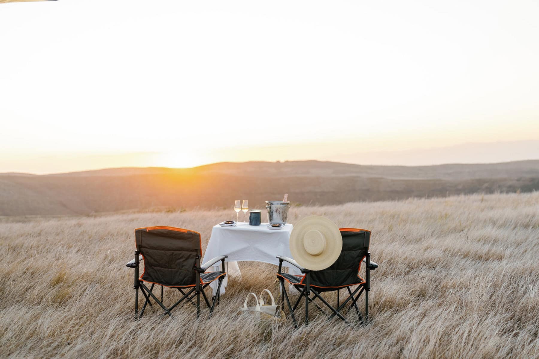 Sundowner setup on a ridge on a helicopter excursion with Miavana by Time + Tide Madagascar